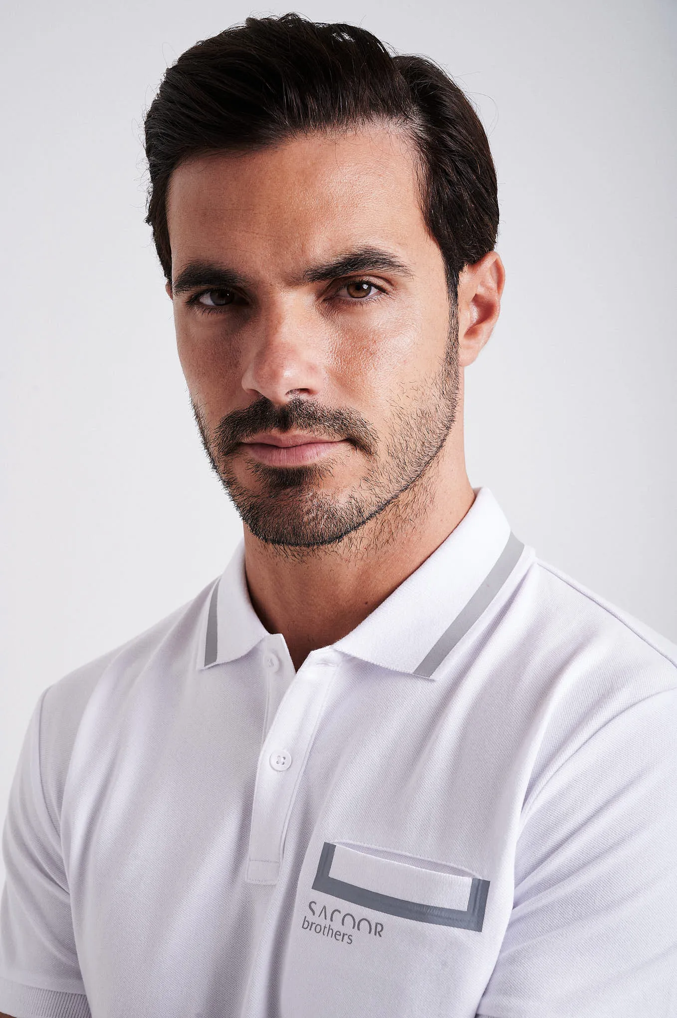 Men's cotton piquet polo with adhesive tape on chest pocket