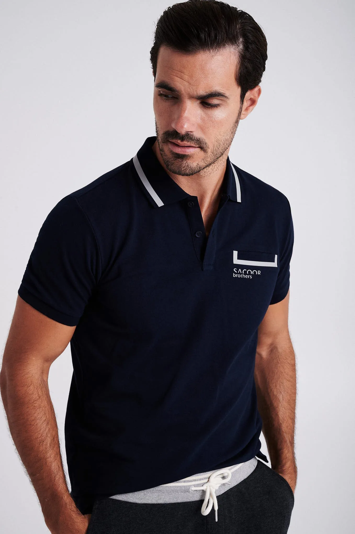 Men's cotton piquet polo with adhesive tape on chest pocket